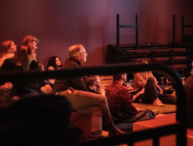 People listening to a talk in the studio