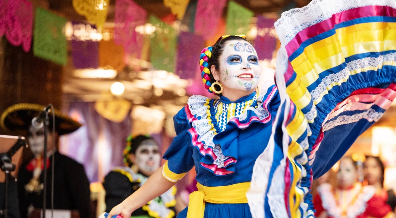 Woman dancing in colorful dress