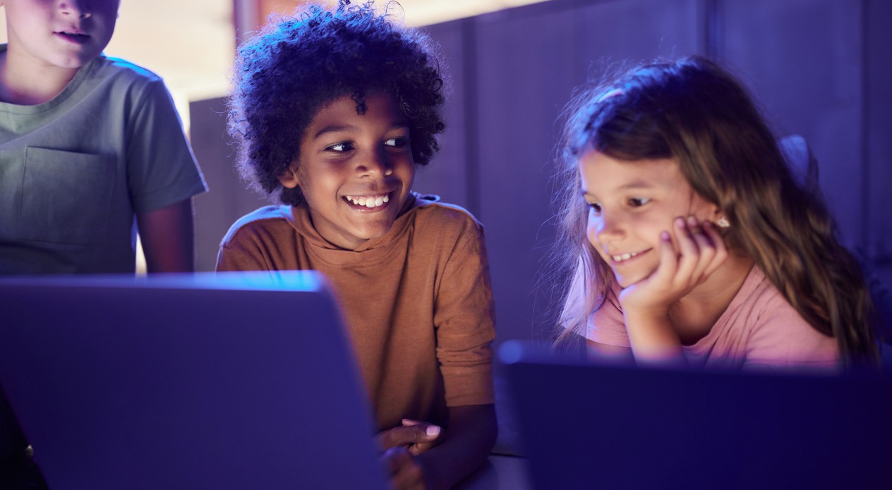 schoolkids watching laptop