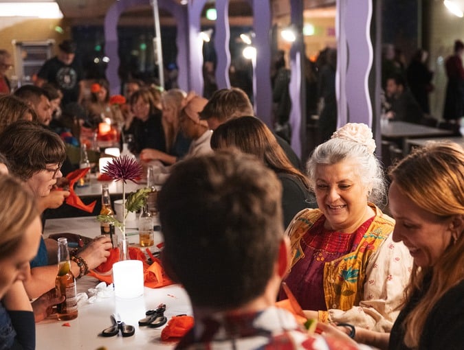 People crafting at a noche de muertos event