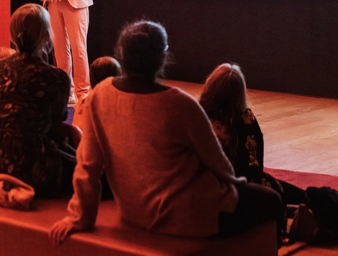 People listening to a talk in the studio