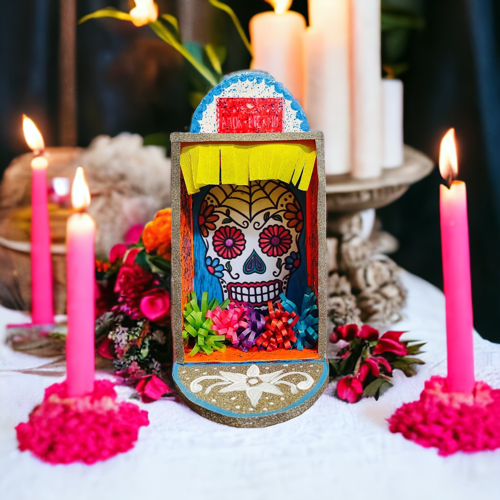A memory box with a scull, lighted candles